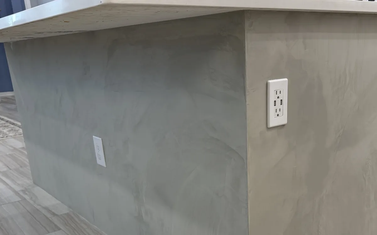 Kitchen island finished in hand-troweled gray Venetian plaster in Parrish