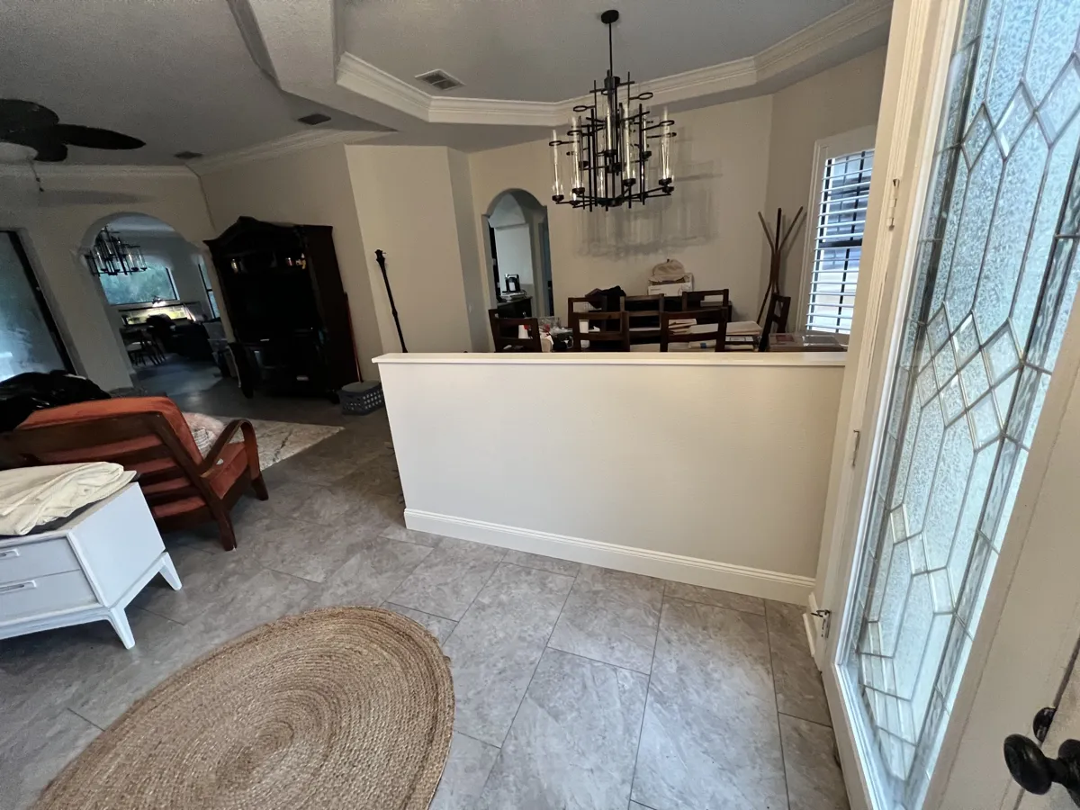 After: the finished half wall with drywall, matching texture, cap, baseboard and fresh paint