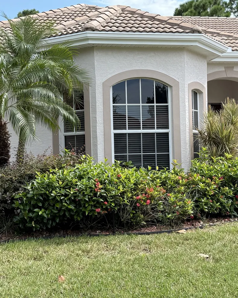 After: finished exterior with fresh paint on walls and trim