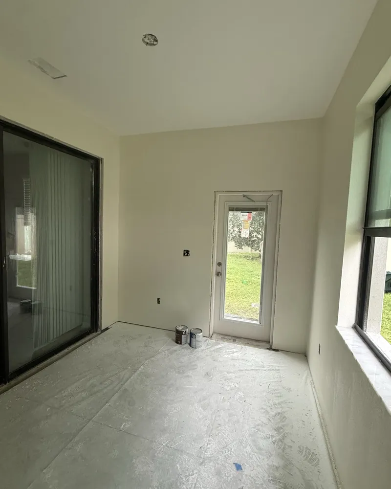 After: the new room with finished ceiling and walls painted a warm off-white