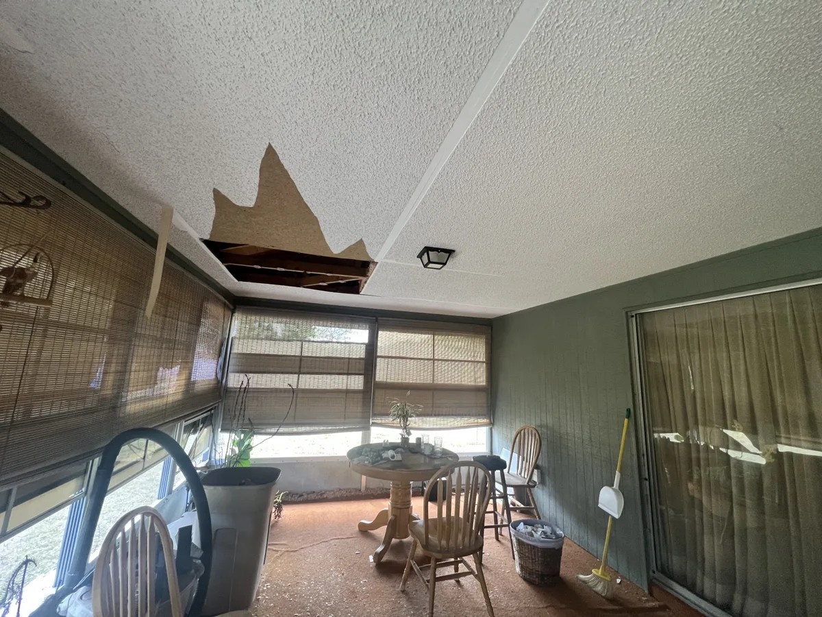 Before: Florida room ceiling with water-damaged, collapsing textured ceiling panels