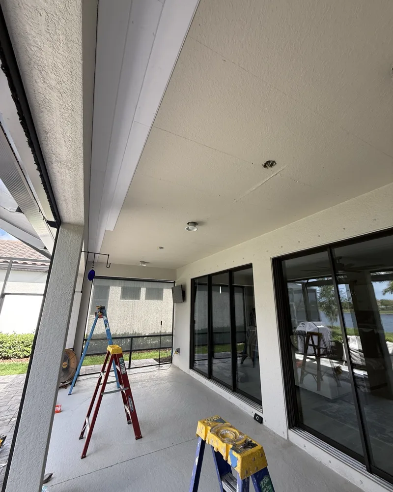 Before: plain stucco lanai ceiling with old light openings