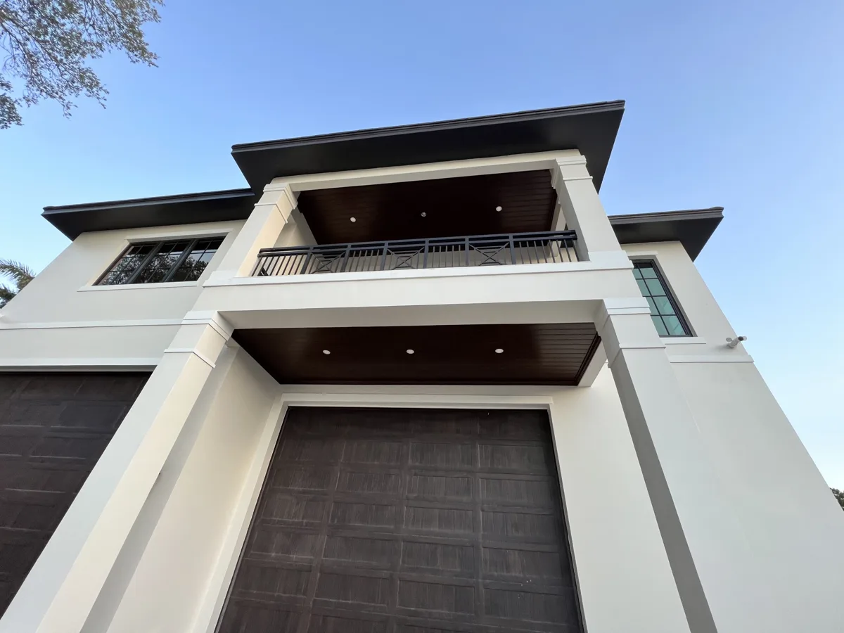 Two-story porch and balcony ceilings finished in wood-grain VersaTex in Palmetto