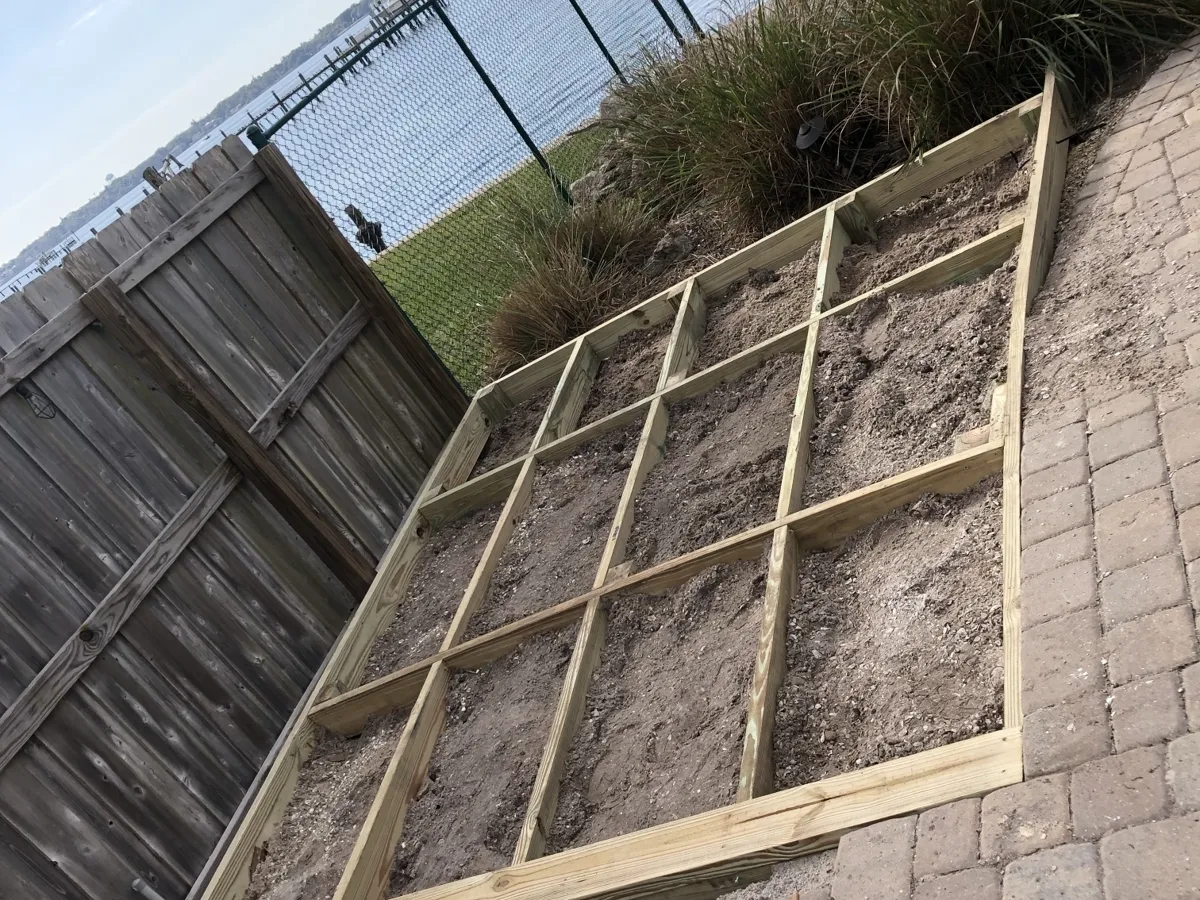 Process: pressure-treated wood deck frame built on the paver patio for a waterfront outdoor kitchen