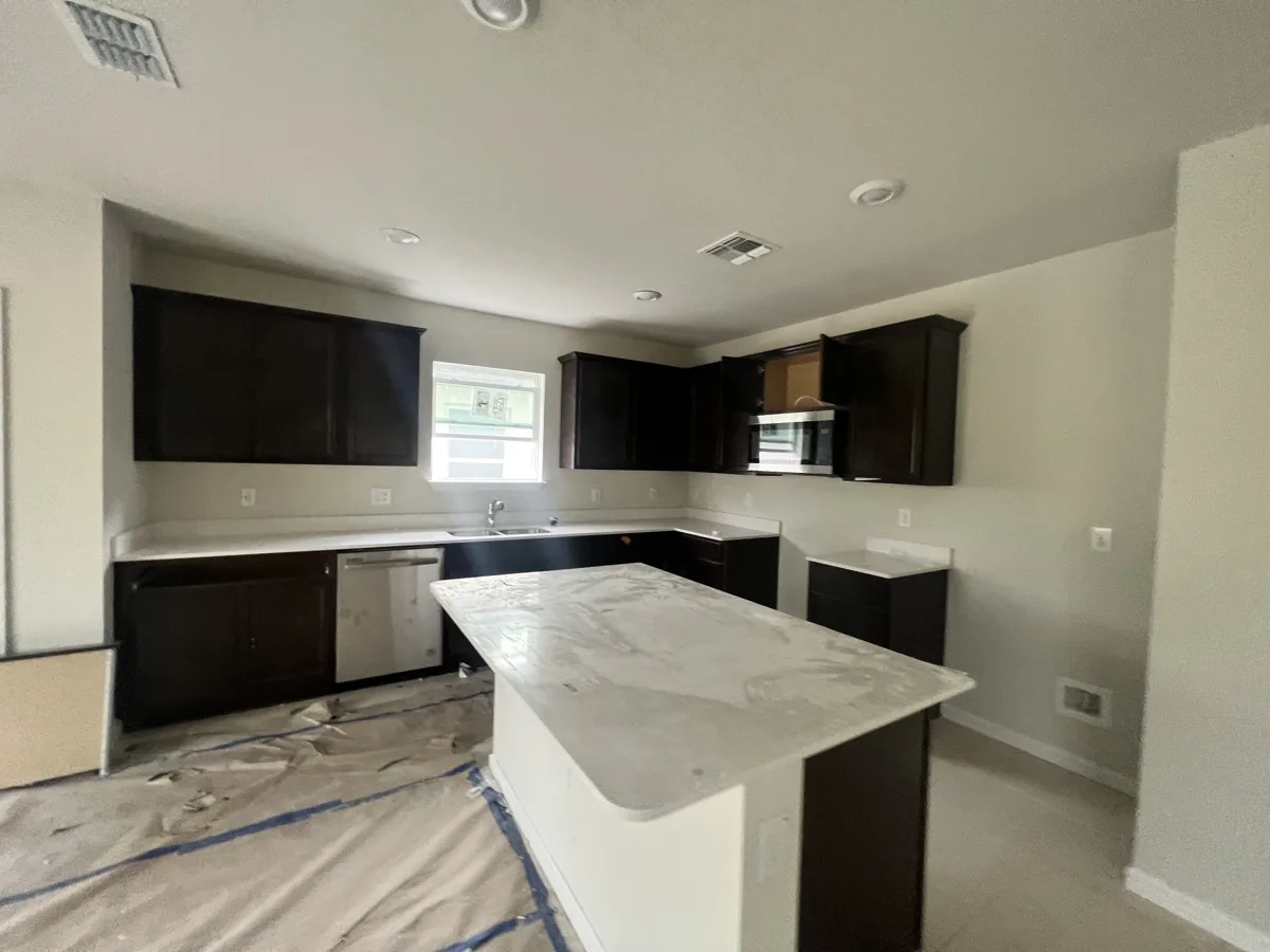 Before: kitchen with dark espresso-stained cabinets and island